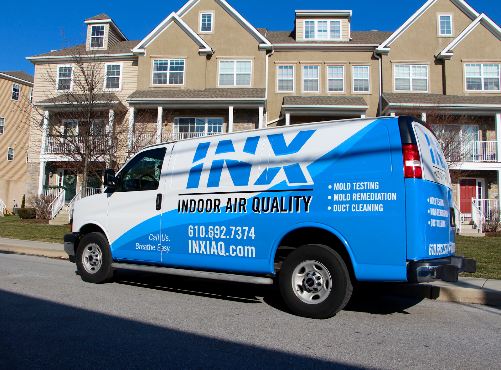 INX Indoor Air Quality professional mold removal ardmore van in front of residential homes