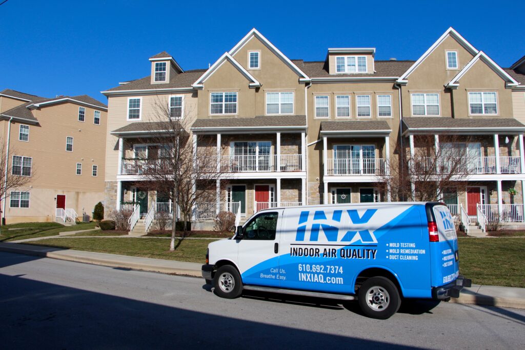 INX Indoor Air Quality van parked outside of a client's home